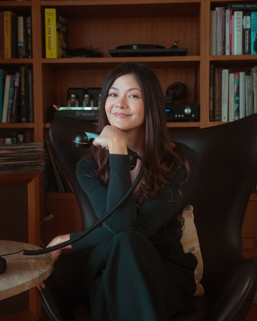 Cat Goetze, founder of Physical Phones and CatGPT creator, holding a retro-style Bluetooth phone
